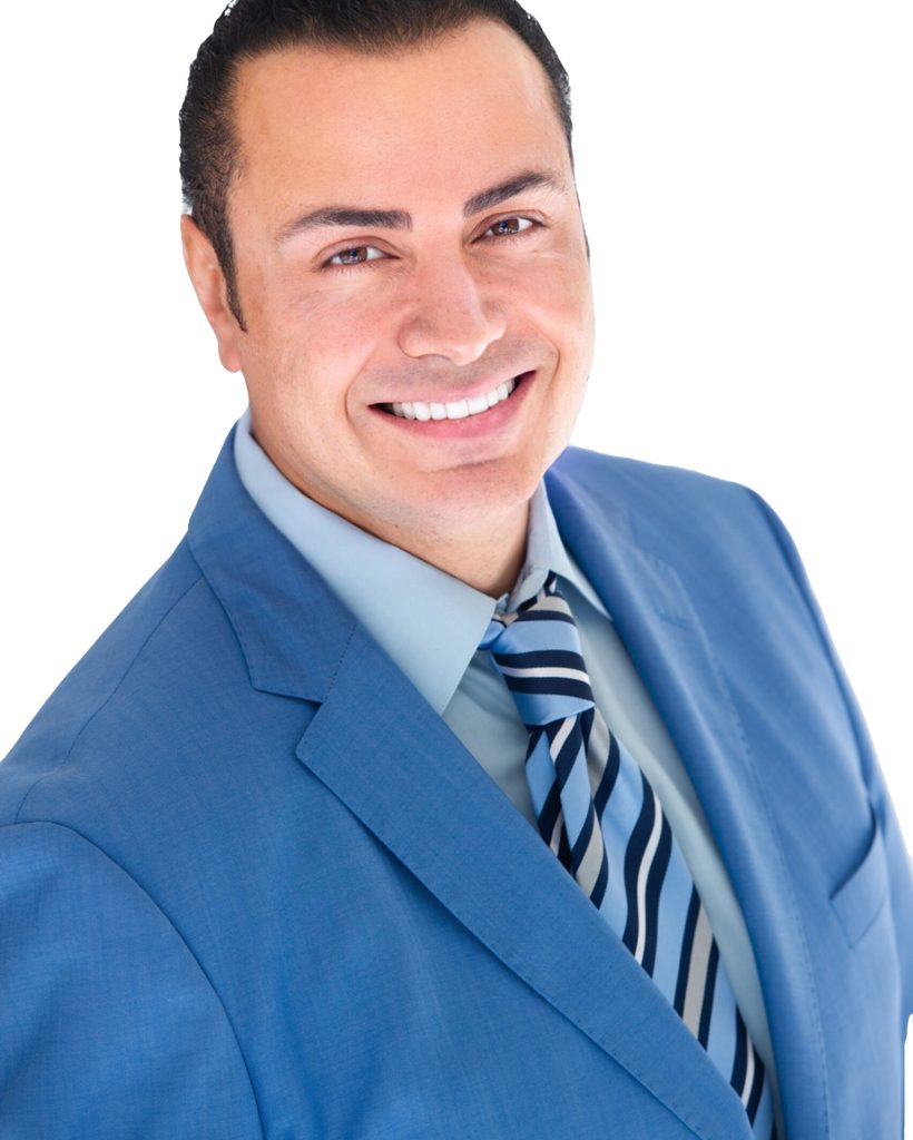 Dr. Sameer Aljanedi in a blue suit smiling